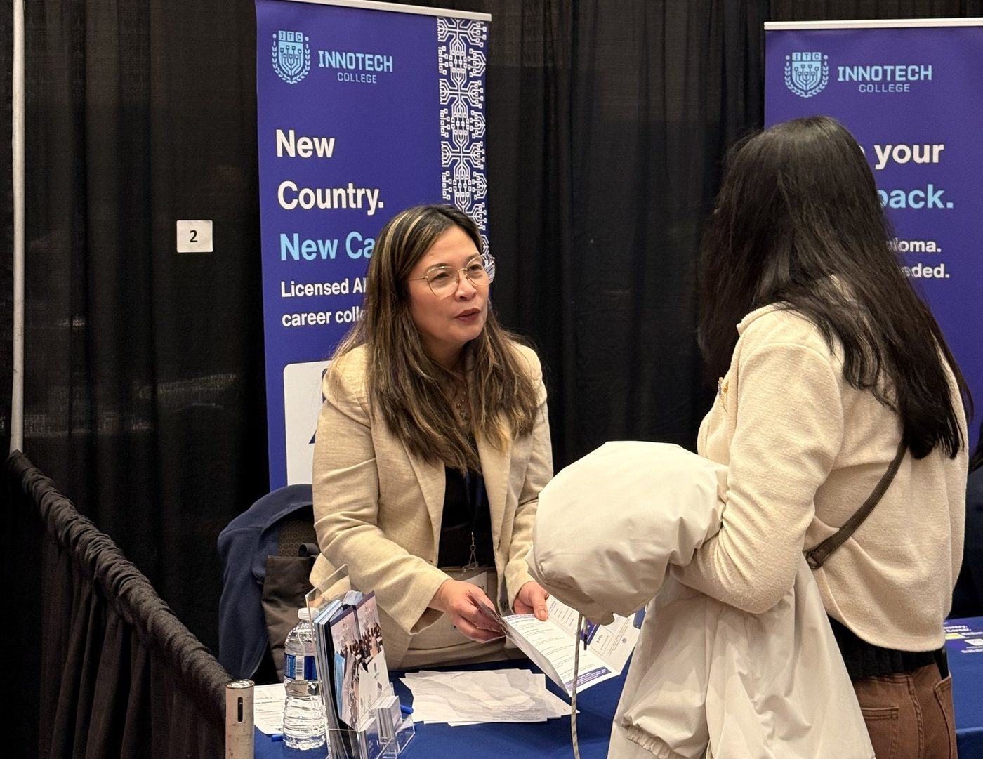 An InnoTech College advisor speaking with a prospective student